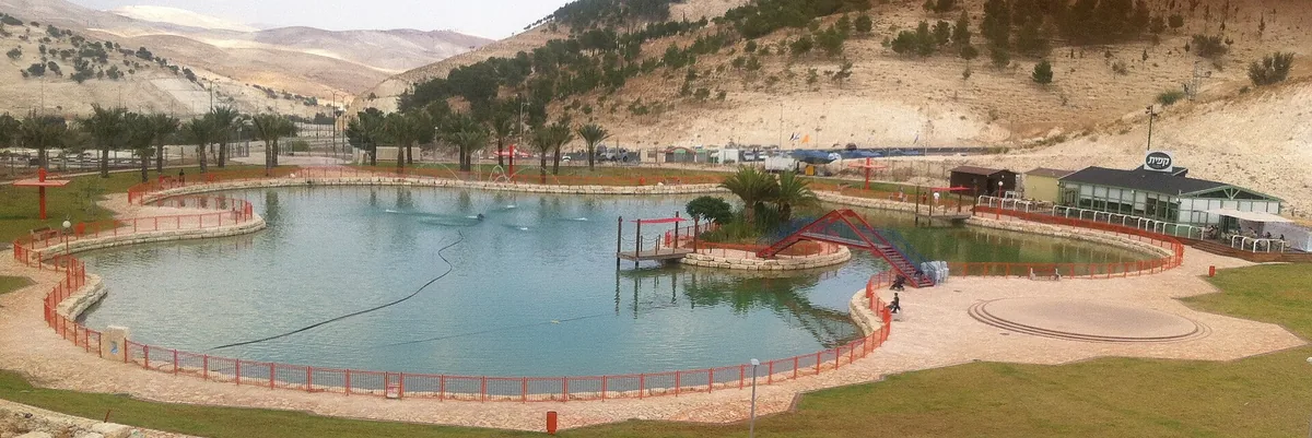 The artificial lake and lawns at the entrance to Ma'ale Adumim