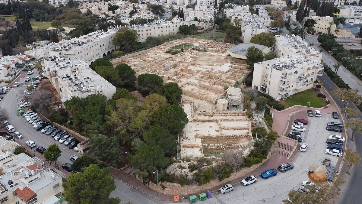 Aerial view of the excavated Martyrius monastery among apartment blocks in Ma'ale Adumim